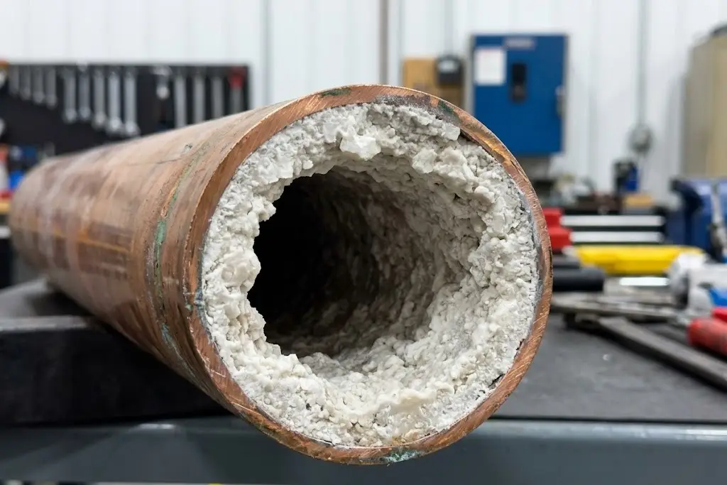 Cross Section of Scaled Chiller Condenser Tubes showing thick mineral crust